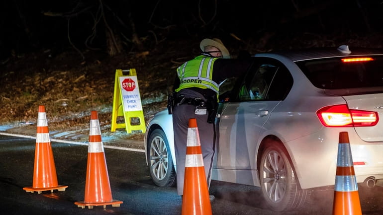 State troopers operate a sobriety checkpoint on the Newbridge Road...
