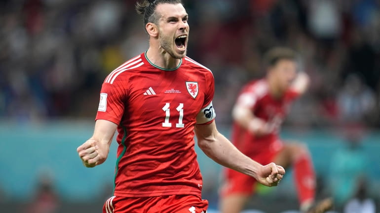 FILE - Wales' Gareth Bale celebrates after scoring his side's...