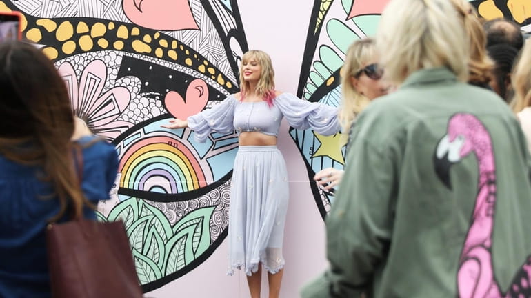 Taylor Swift surprised fans at the "What Lifts You Up"...