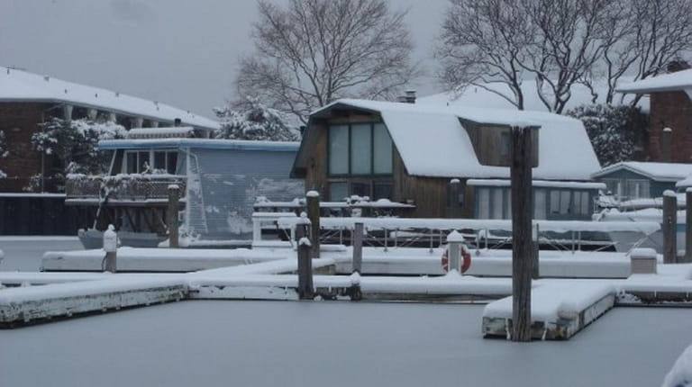 The "Garlic Knot" is covered in snow at Toms Point Marina...