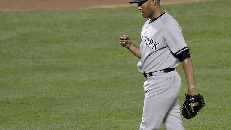 American League pitcher Mariano Rivera of the Yankees pumps his...