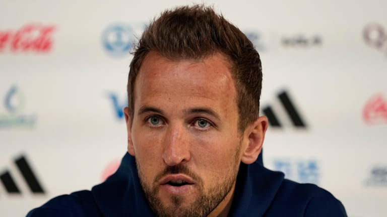 England's Harry Kane speaks to the media during a press...