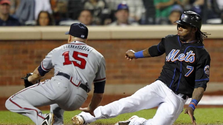 Atlanta Braves pitcher Tim Hudson covers the plate after throwing...