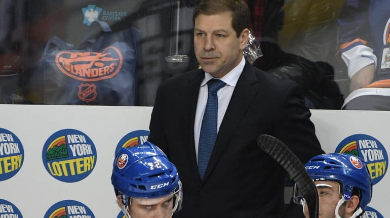New York Islanders interim head coach Doug Weight looks on...