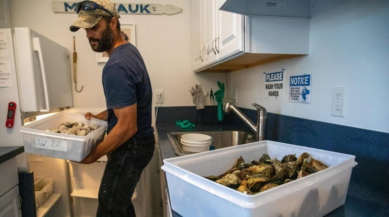 Clint Bennett works out of his garage shellfish business in Montauk....