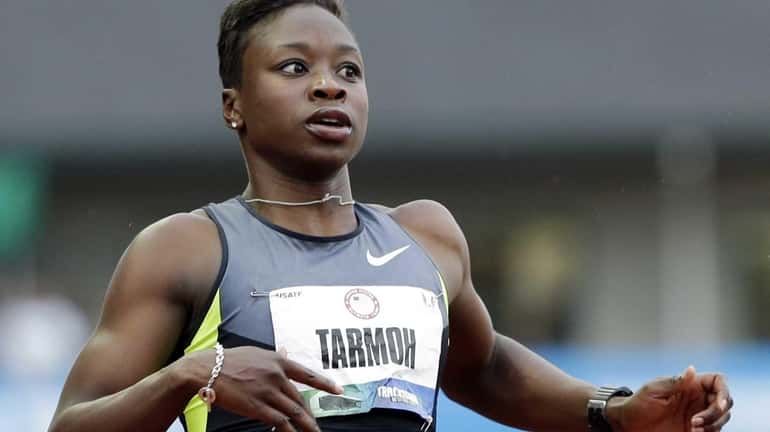 Jeneba Tarmoh finishes first in her heat in the women's...