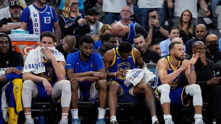 Golden State Warriors guards Klay Thompson, second from left, and...