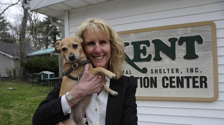 Pamela Green with dogs at Kent adoption center. She supports...