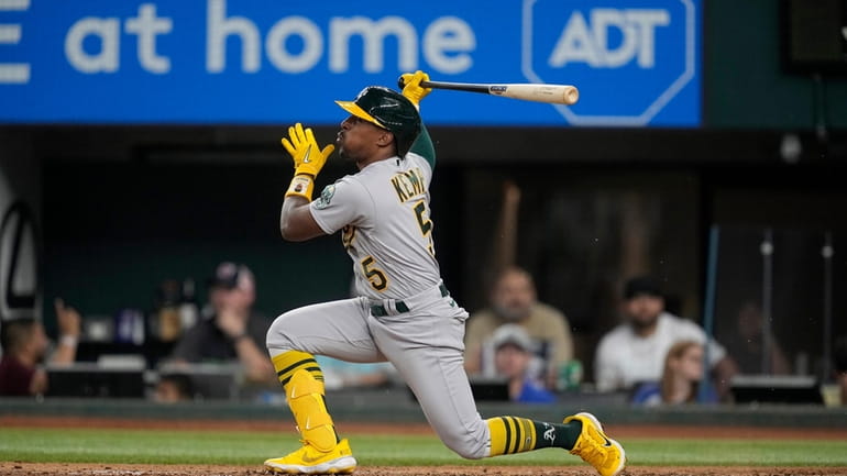Oakland Athletics' Tony Kemp follows through on a swing during...