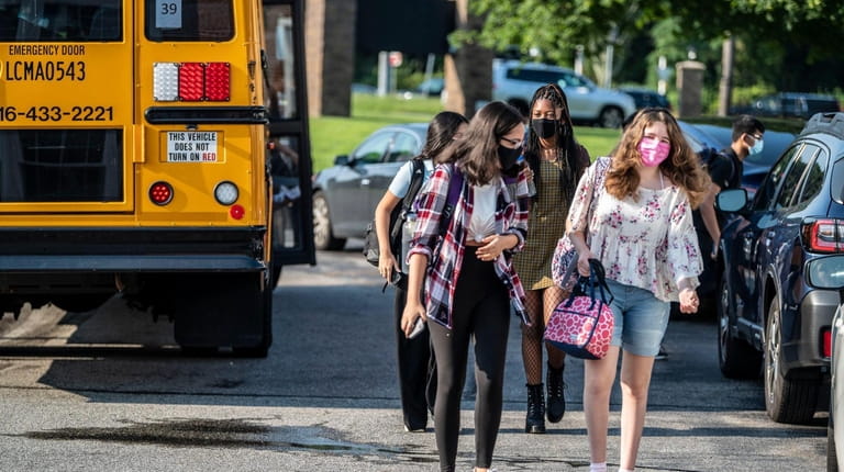 Students head to school Thursday, the first day of classes...