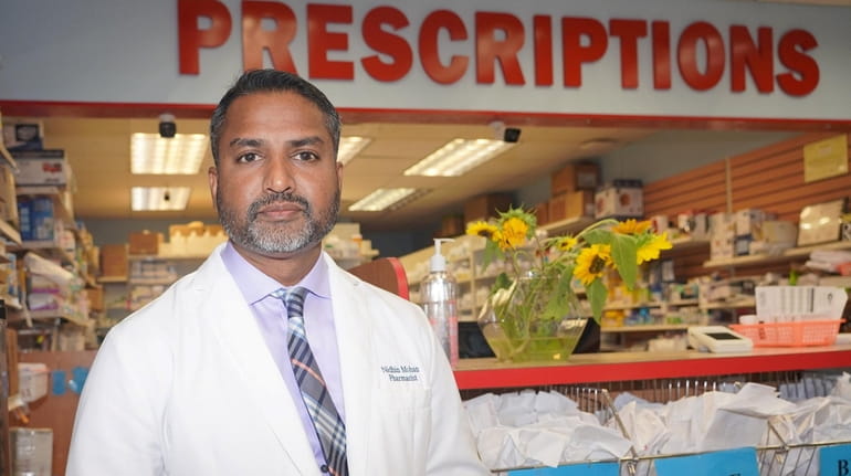 Nidhin Mohan, owner of New Island Pharmacy in Deer Park,...