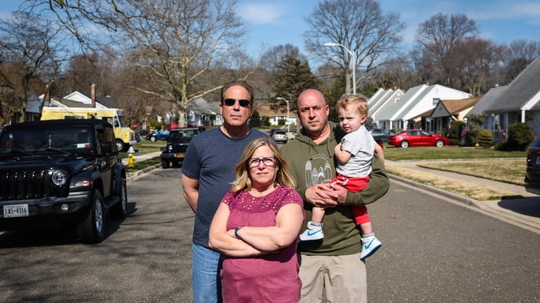 Homeowners Carmine Aufiero, left, Susan Miles and Ryan Schneider, with...