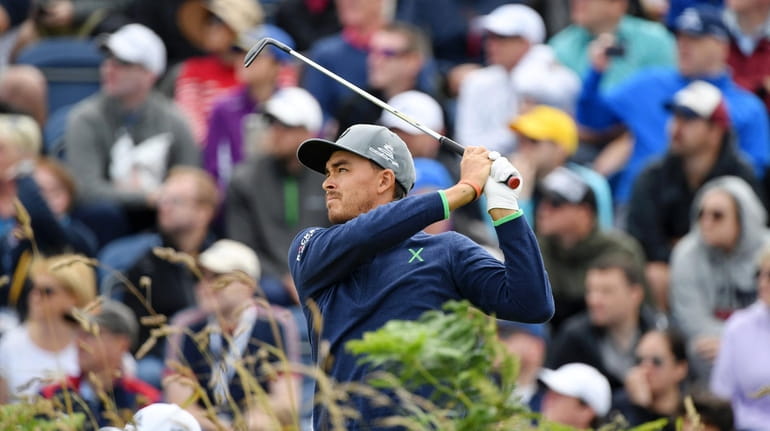 Rickie Fowler of the United States plays a shot on...