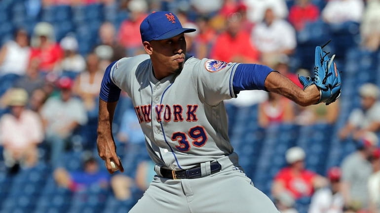 Edwin Diaz of the New York Mets delivers a pitch...
