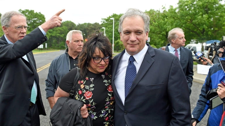 Linda and Edward Mangano outside federal court in Central Islip...