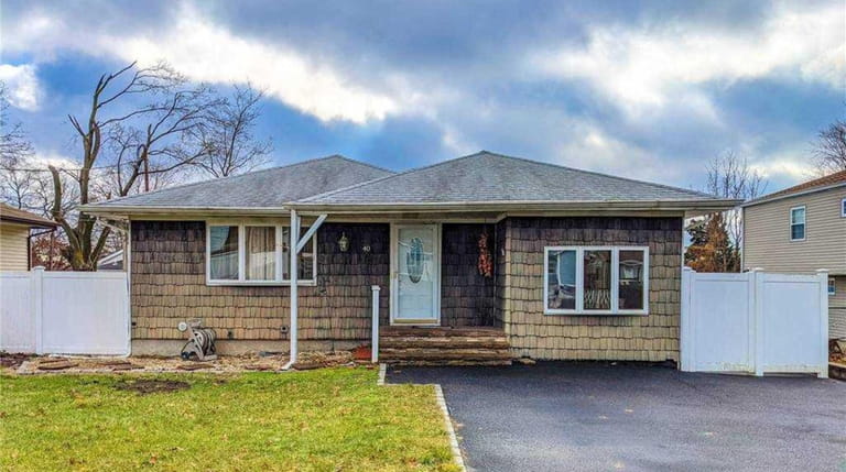 Priced at $379,999, this 1971 ranch on Pinelawn Avenue in Farmingville has...
