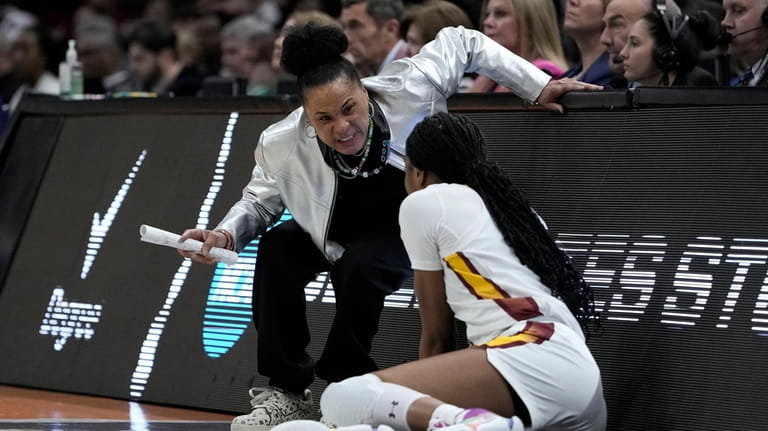 South Carolina head coach Dawn Staley talks with guard Bree...