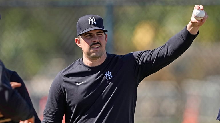 Yankees pitcher Carlos Rodon shows his grip during a spring...