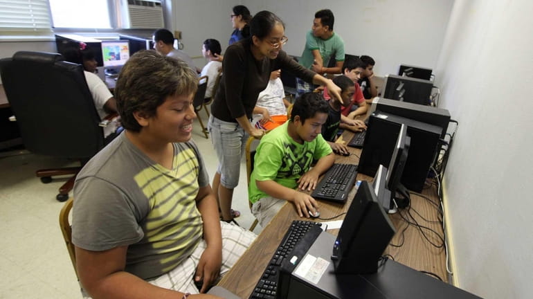 Children use the computer lab as part of the Five...