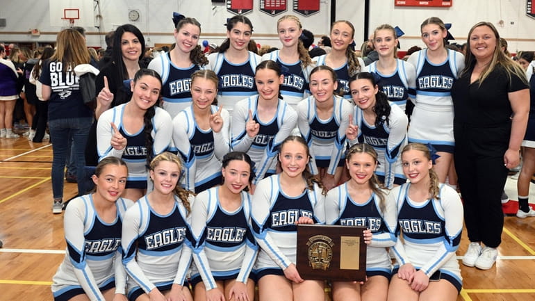 Rocky Point poses with its championship plaque at the Suffolk cheerleading finals on Saturday...