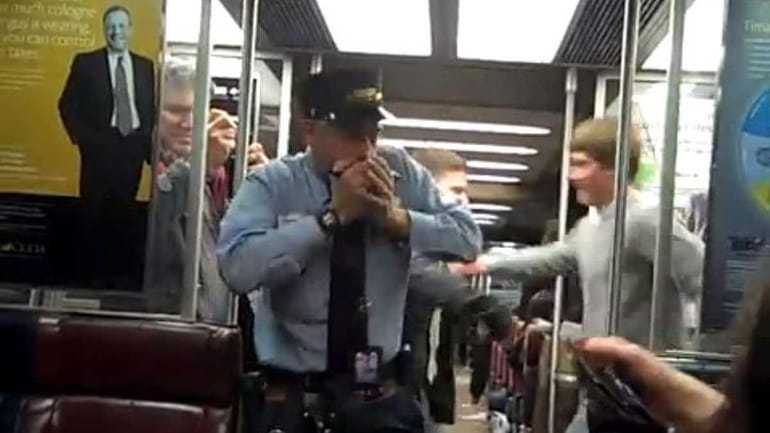This Metro-North Railroad conductor is seen in a YouTube video...