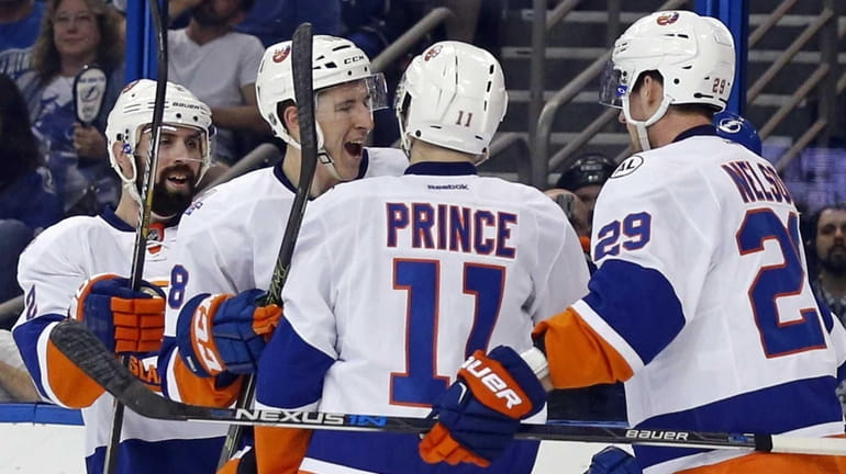 Shane Prince #11 of the New York Islanders is congratulated...