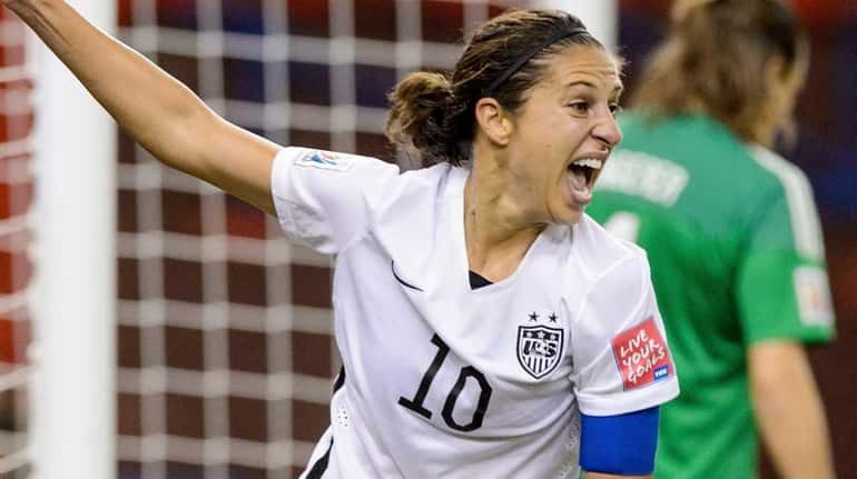 Carli Lloyd of the United States celebrates after assisting on...