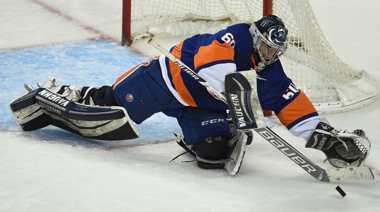 New York Islanders Blue Team goalie Eamon McAdam makes a...