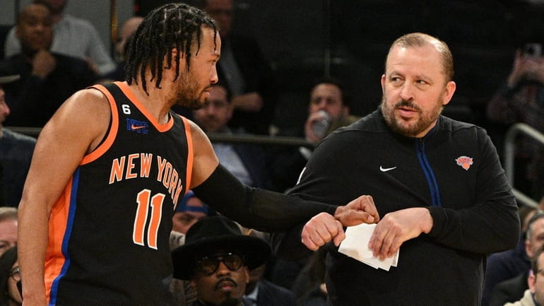 New York Knicks guard Jalen Brunson fist bumps with head...