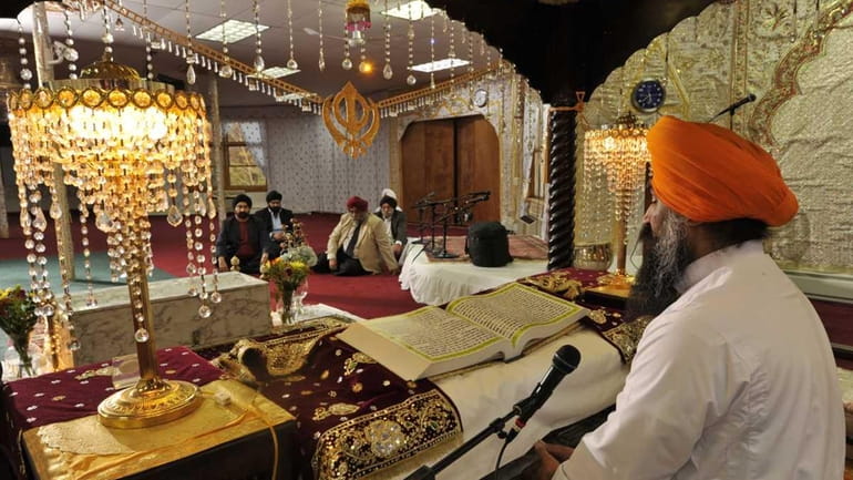 Guru Giani Paramjit Singh conducts a prayer session at Gurudwara...