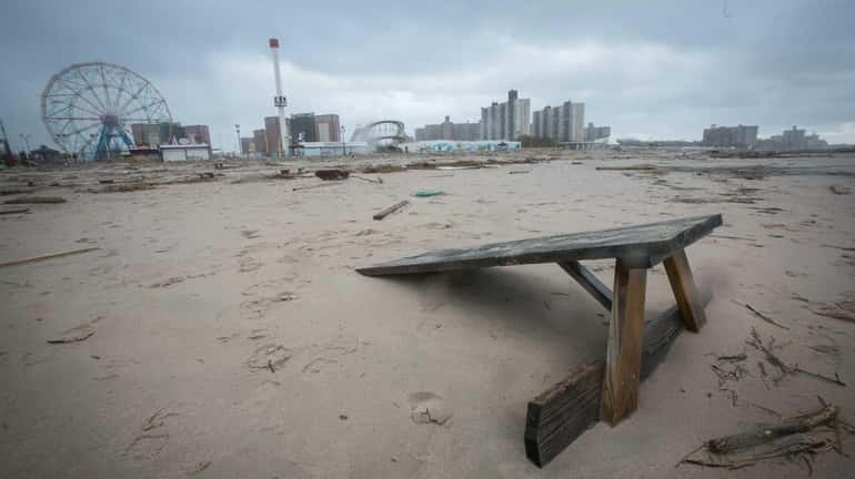 A half covered picnic table on Coney Island's beach the...