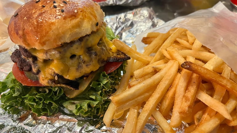 A double cheeseburger and fries at Gimme Burger in Oyster...