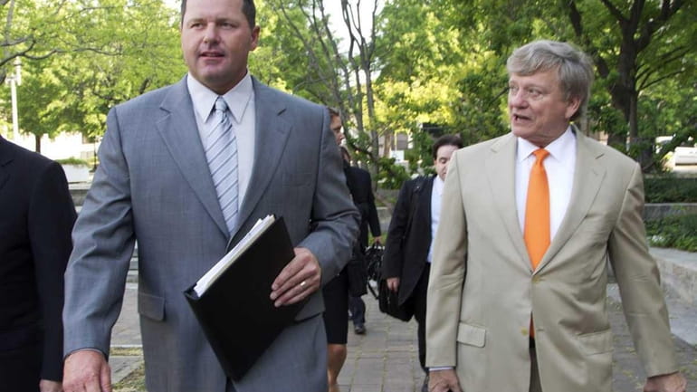 Roger Clemens and his attorney, Rusty Hardin, arrive at federal...