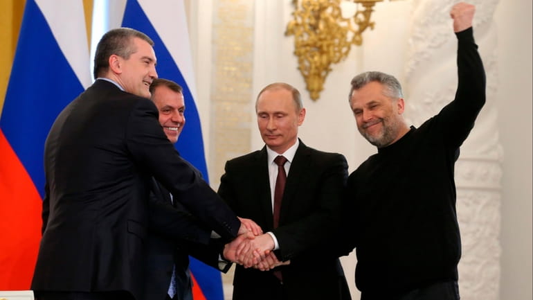 Russian President Vladimir Putin, second right, Speaker of the Crimean...