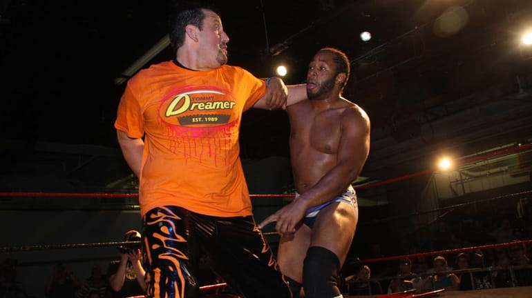 Tommy Dreamer, left, locks up with Jay Lethal at the...