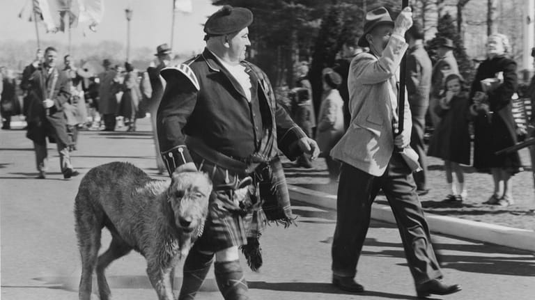 Michael O'Brien, of Cedarhurst, walks his Irish wolfhound Rory O'Moore...