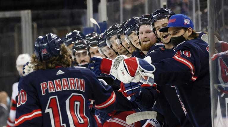 Rangers' Artemi Panarin (10) is congratulated for his second-period goal...