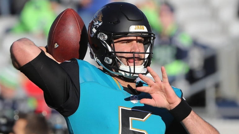 Blake Bortles of the Jaguars warms up prior to a...