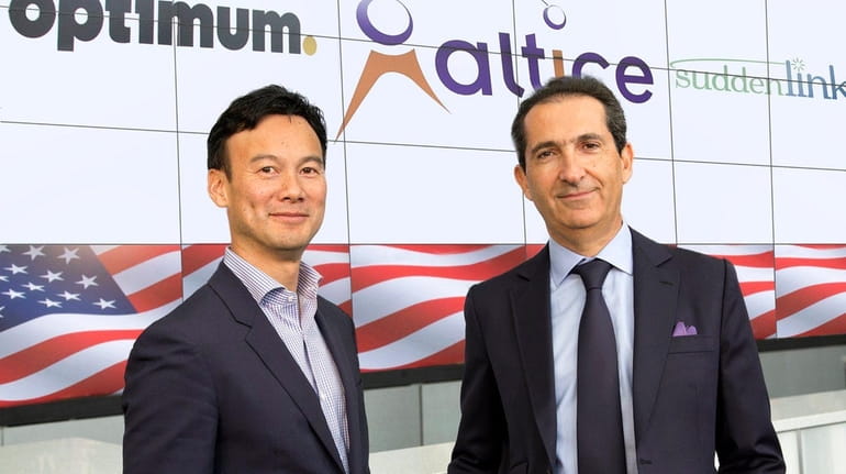Dexter Goei, CEO and chairman of Altice USA, left, and...