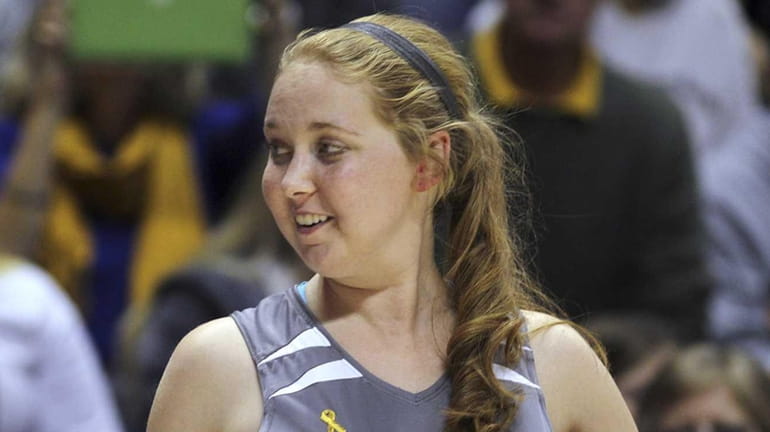 Mount St. Joseph's Lauren Hill gives a thumbs-up as she...