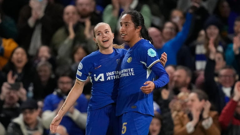 Chelsea's Mayra Ramirez, right, celebrates after scores her side's first...