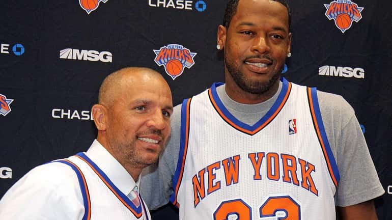 Jason Kidd, left, and Marcus Camby pose at a press...