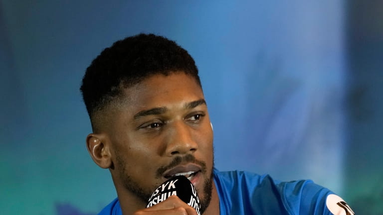 FILE _ Britain's Anthony Joshua speaks during a press conference...