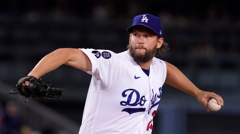 FILE - Los Angeles Dodgers starting pitcher Clayton Kershaw throws...