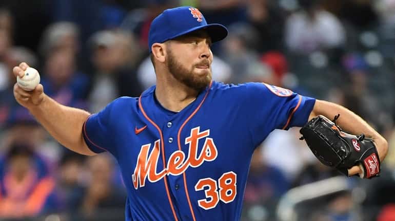 Mets starting pitcher Tylor Megill delivers against the Brewers during...