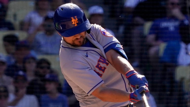 The Mets' J.D. Davis hits an RBI double during the...