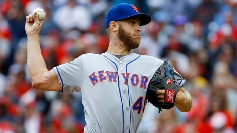 Mets pitcher Zack Wheeler delivers during the second inning of a...