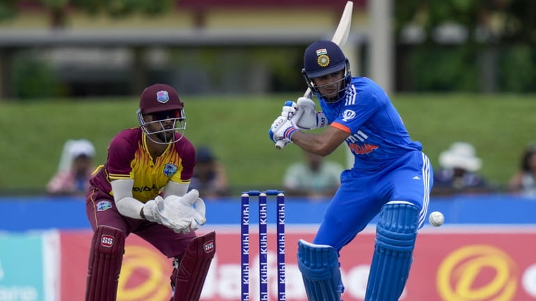 India's Shubman Gill plays a shot against West Indies during...