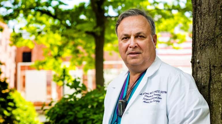Dr. Alexander Axelrad of Winthrop-University Hospital in Mineola supports a...