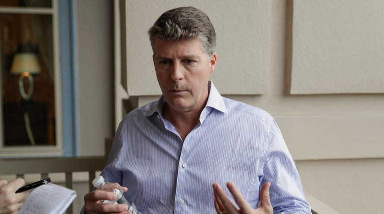 Hal Steinbrenner, principal owner of the Yankees, talks with reporters...